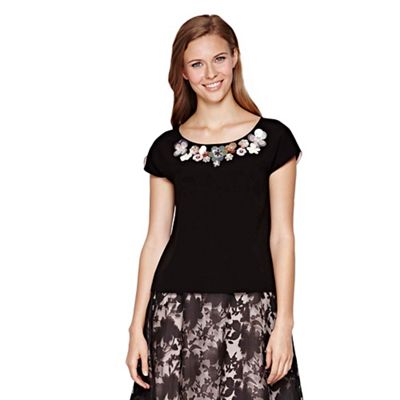Yumi Black Shell Top With Floral Embellishment